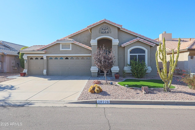 view of front of property with a garage