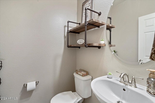 bathroom with sink and toilet