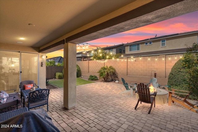 patio terrace at dusk with an outdoor fire pit