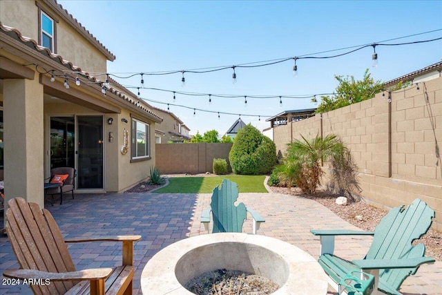 view of patio with a fire pit