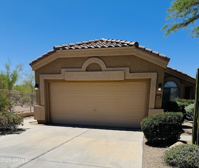 4327 E Desert Sky Ct, Cave Creek, AZ 85331 - view of front of property featuring a tiled roof, stucco siding, a garage, and concrete driveway