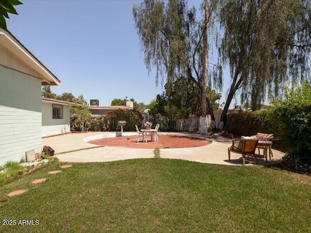 view of yard with a patio area and a fenced backyard