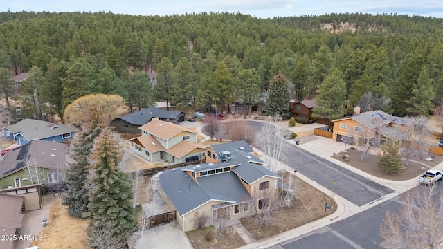 aerial view with a residential view and a wooded view