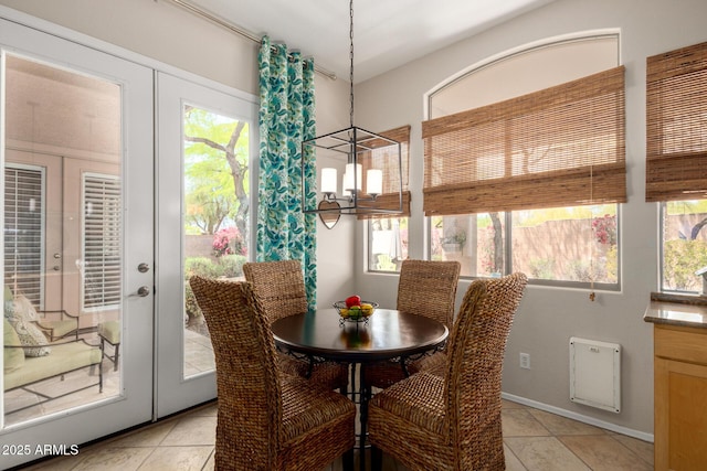 22232 N 48th St, Phoenix, AZ 85054 - dining area with french doors and light tile patterned floors