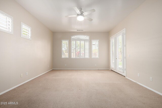 22232 N 48th St, Phoenix, AZ 85054 - empty room with visible vents, a ceiling fan, baseboards, and light carpet