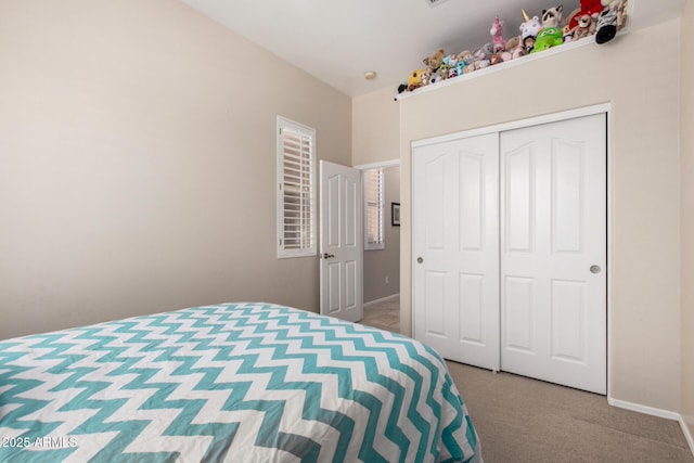 22232 N 48th St, Phoenix, AZ 85054 - bedroom with baseboards, carpet, and a closet