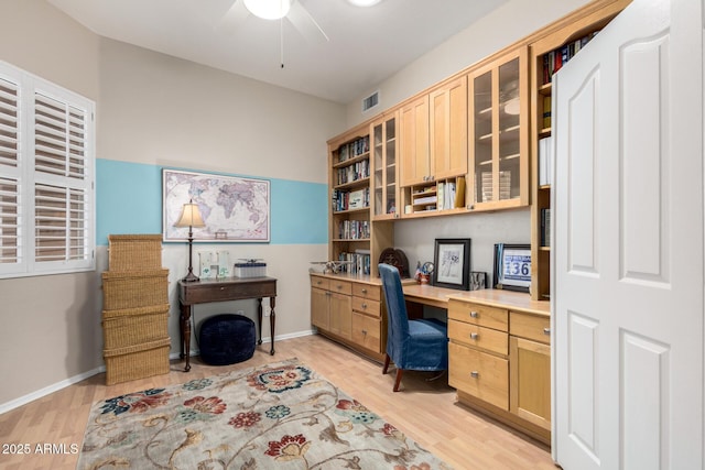 22232 N 48th St, Phoenix, AZ 85054 - office space featuring built in desk, light wood-style floors, a ceiling fan, baseboards, and visible vents