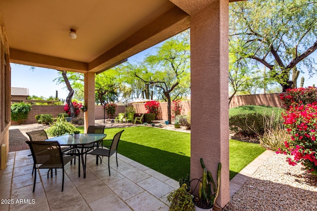 22232 N 48th St, Phoenix, AZ 85054 - view of patio featuring a fenced backyard and outdoor dining space