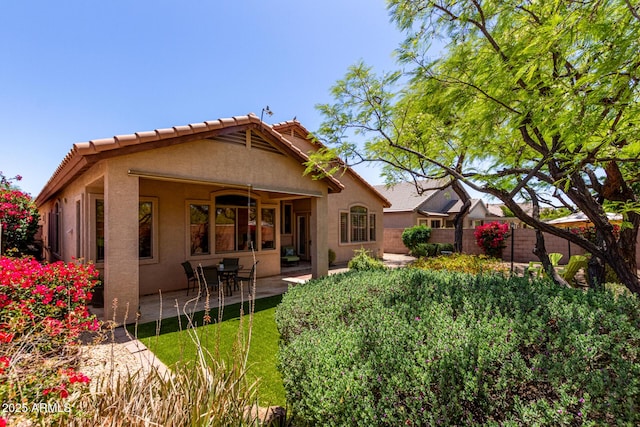 22232 N 48th St, Phoenix, AZ 85054 - rear view of property featuring a fenced backyard, a patio area, and stucco siding