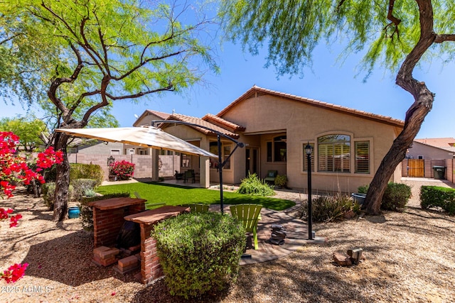 22232 N 48th St, Phoenix, AZ 85054 - back of house with a patio, stucco siding, a tiled roof, and fence
