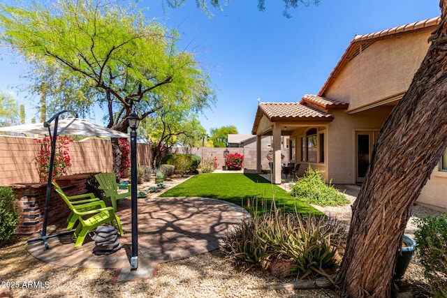 22232 N 48th St, Phoenix, AZ 85054 - view of yard with a fenced backyard and a patio area