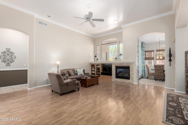 22232 N 48th St, Phoenix, AZ 85054 - living area featuring visible vents, light wood-style floors, baseboards, ceiling fan, and arched walkways