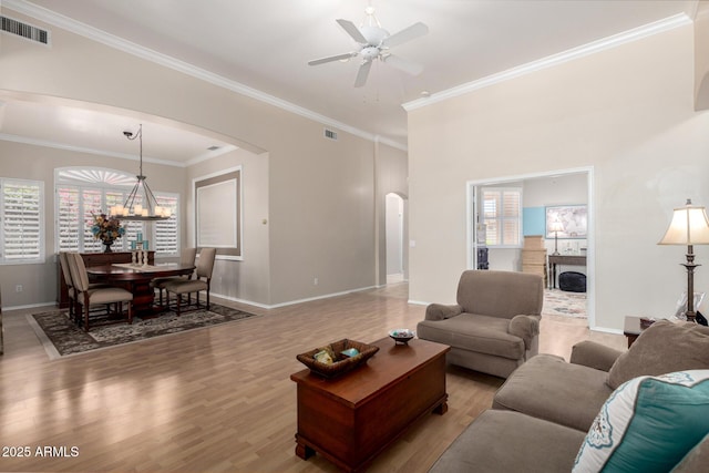 22232 N 48th St, Phoenix, AZ 85054 - living area with visible vents, arched walkways, ceiling fan, and light wood-type flooring