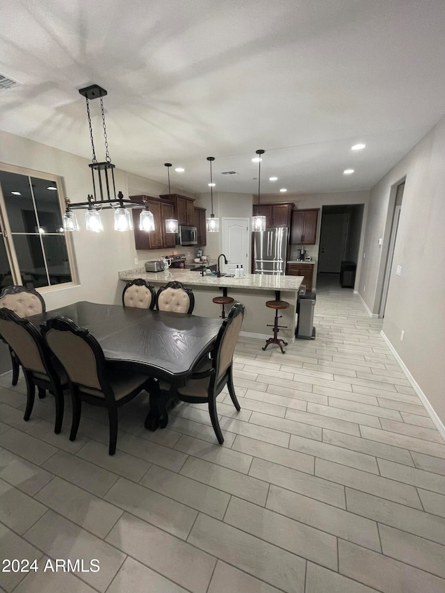 dining room featuring light hardwood / wood-style floors