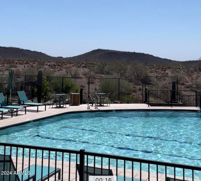 view of pool featuring a mountain view