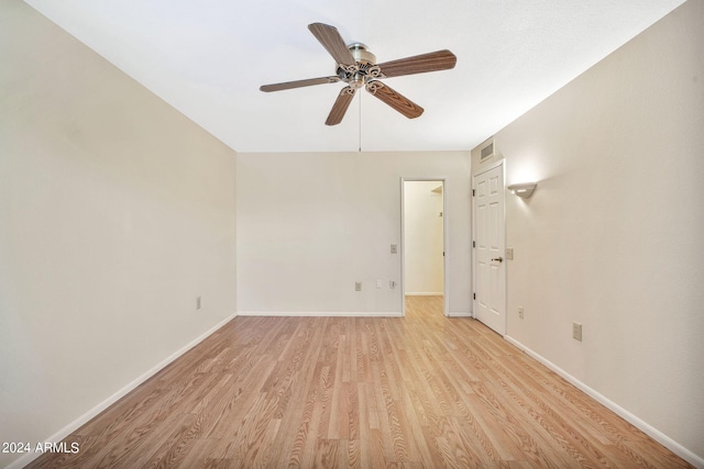 empty room with light wood-type flooring and ceiling fan