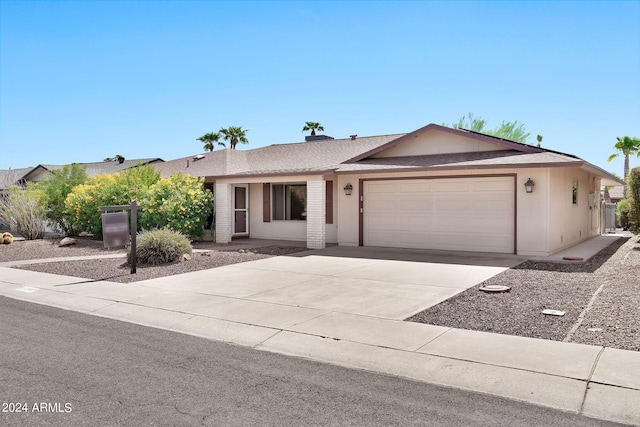 single story home featuring a garage