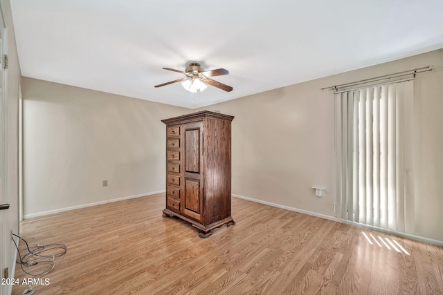 spare room featuring light wood-type flooring and ceiling fan