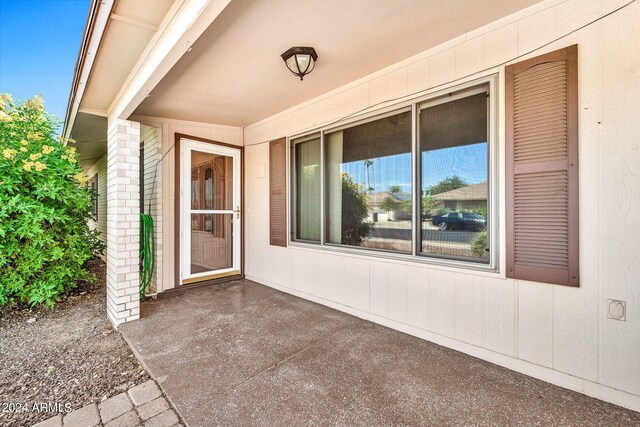 doorway to property with a patio