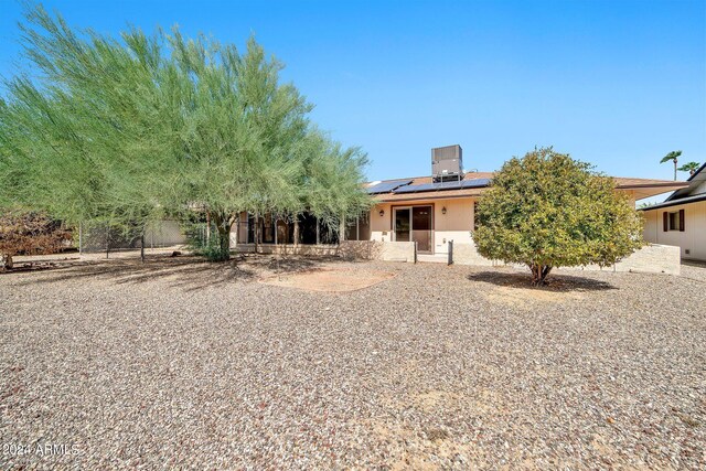 back of property with solar panels