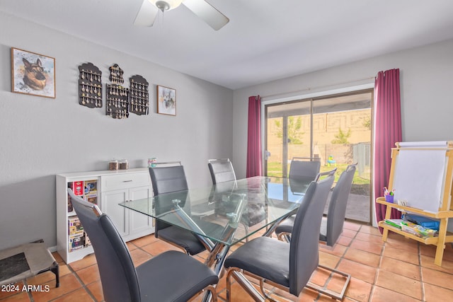 dining space featuring ceiling fan and light tile floors