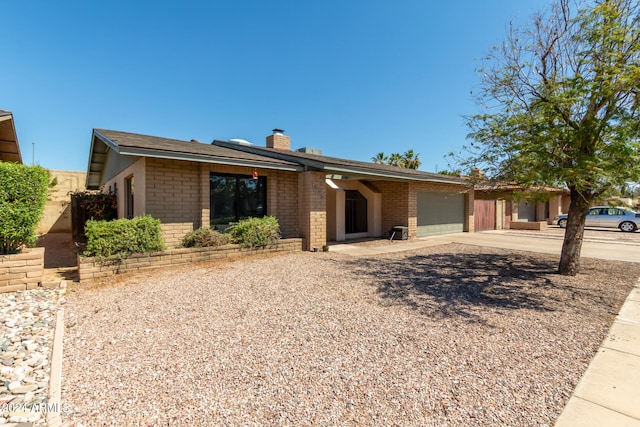 ranch-style house featuring a garage