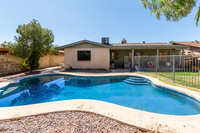 view of pool featuring central AC unit