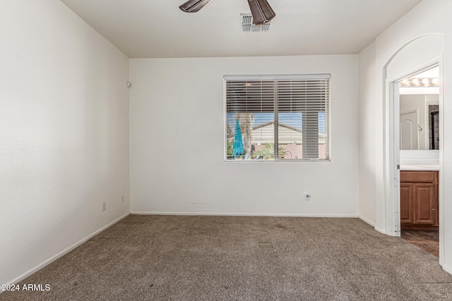 carpeted empty room with ceiling fan