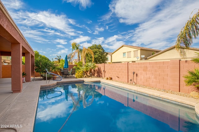 view of swimming pool with a patio