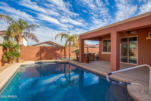 view of pool with a patio and ceiling fan