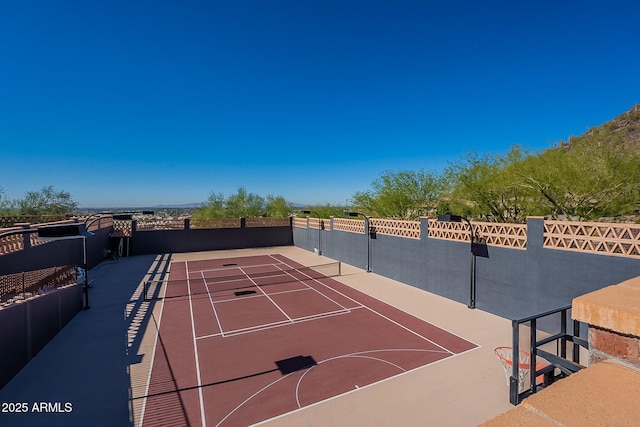 view of tennis court featuring basketball court