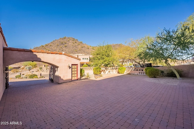 view of front facade featuring a mountain view and a patio