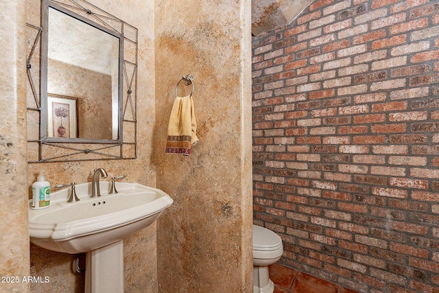 bathroom featuring tile patterned flooring and toilet