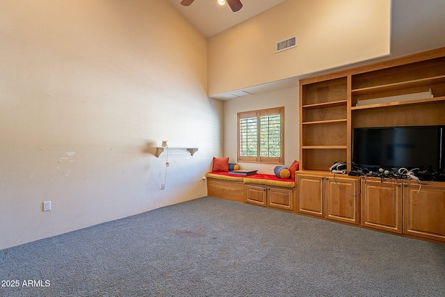 living room with carpet, high vaulted ceiling, and ceiling fan