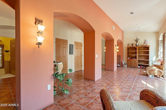 hall featuring tile patterned flooring