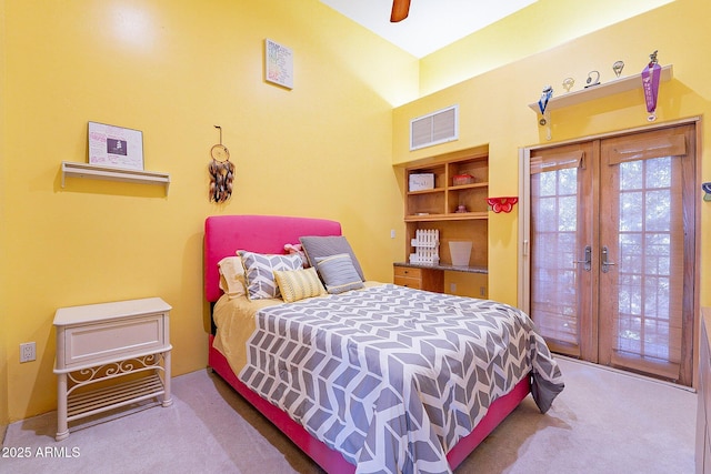 bedroom featuring french doors, ceiling fan, access to exterior, and carpet flooring