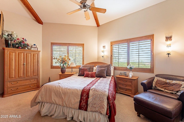 carpeted bedroom with multiple windows, ceiling fan, and lofted ceiling with beams