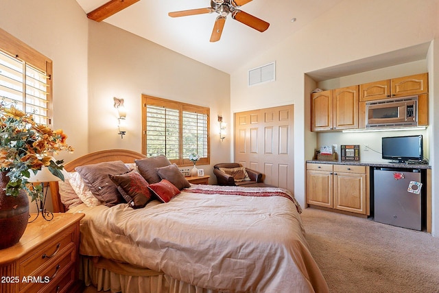 carpeted bedroom with high vaulted ceiling, stainless steel refrigerator, a closet, ceiling fan, and beam ceiling