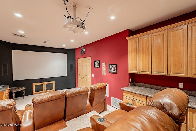 home theater with light colored carpet