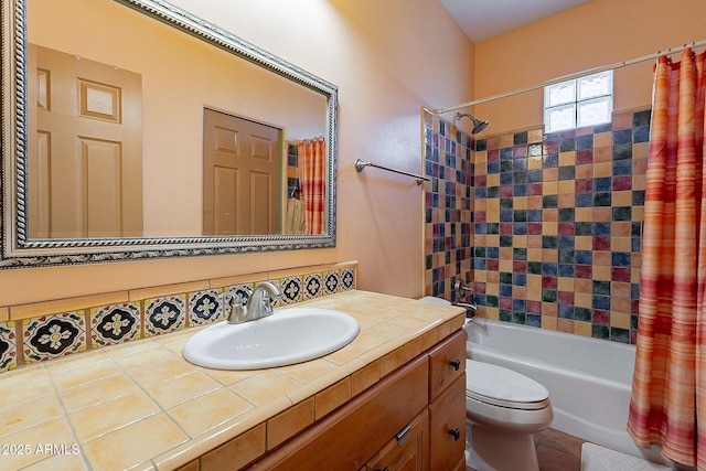 full bathroom featuring vanity, shower / bathtub combination with curtain, and toilet