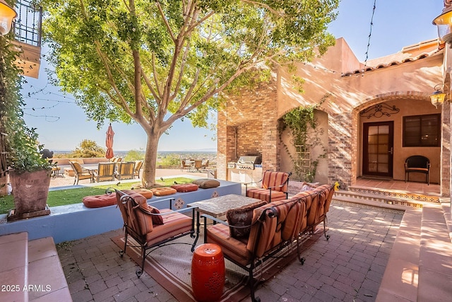 view of patio featuring exterior kitchen and outdoor lounge area