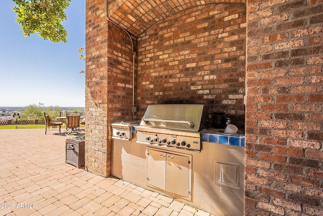 view of patio / terrace featuring an outdoor kitchen and area for grilling