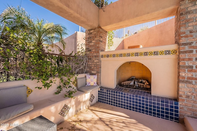 view of patio featuring an outdoor living space with a fireplace