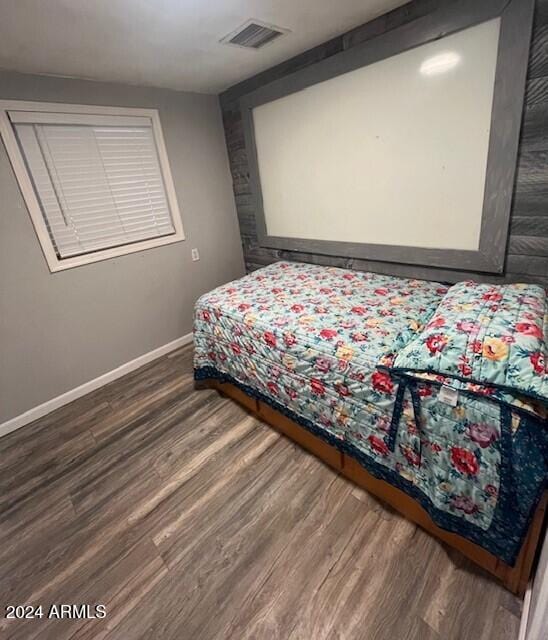 bedroom featuring dark hardwood / wood-style floors