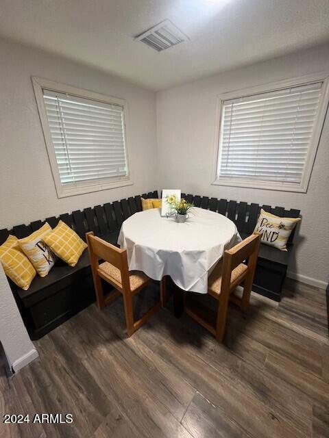 dining room with dark wood-type flooring