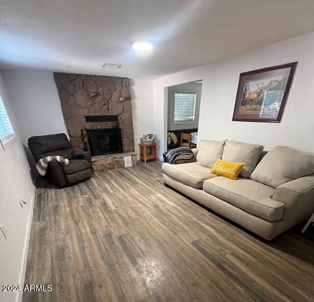 living room featuring hardwood / wood-style floors and a fireplace