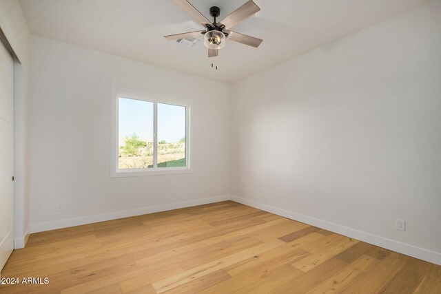 unfurnished room with ceiling fan and light hardwood / wood-style flooring