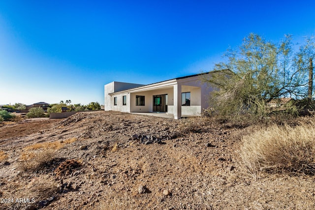 rear view of property featuring a patio