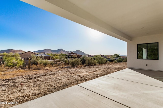 view of patio / terrace featuring a mountain view