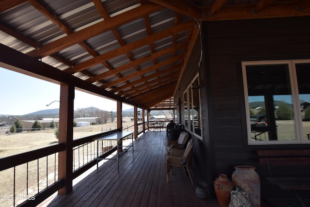 wooden deck with a mountain view